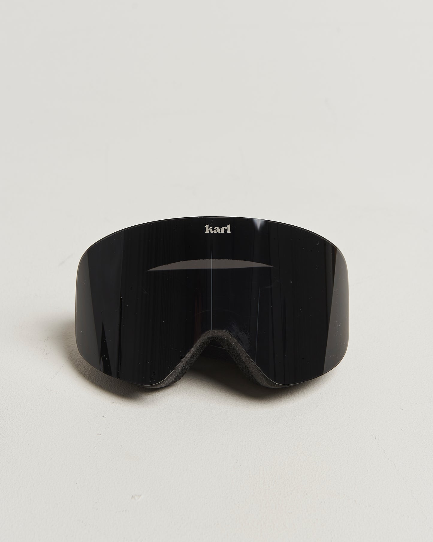 Black ski goggles with black lens front view
