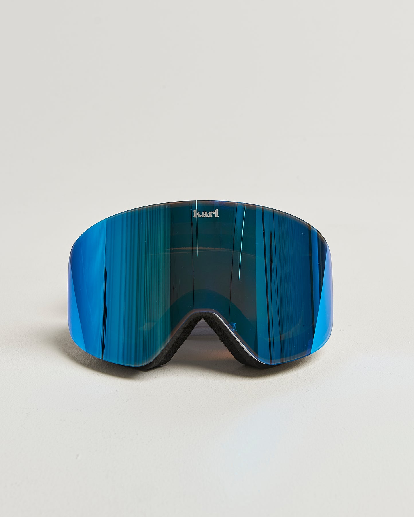 White ski goggles with blue lens front view