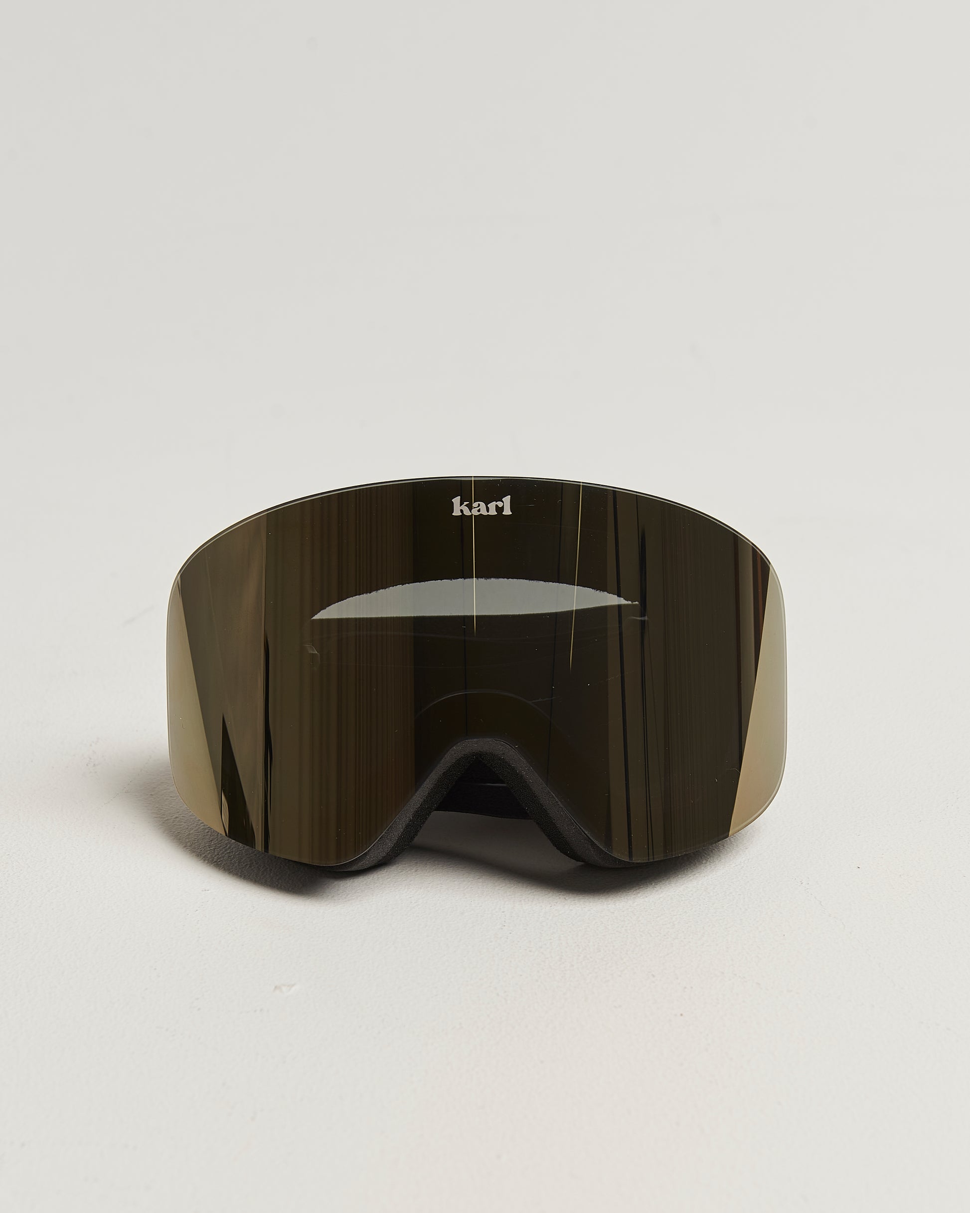 Black ski goggles with bronze lens front view