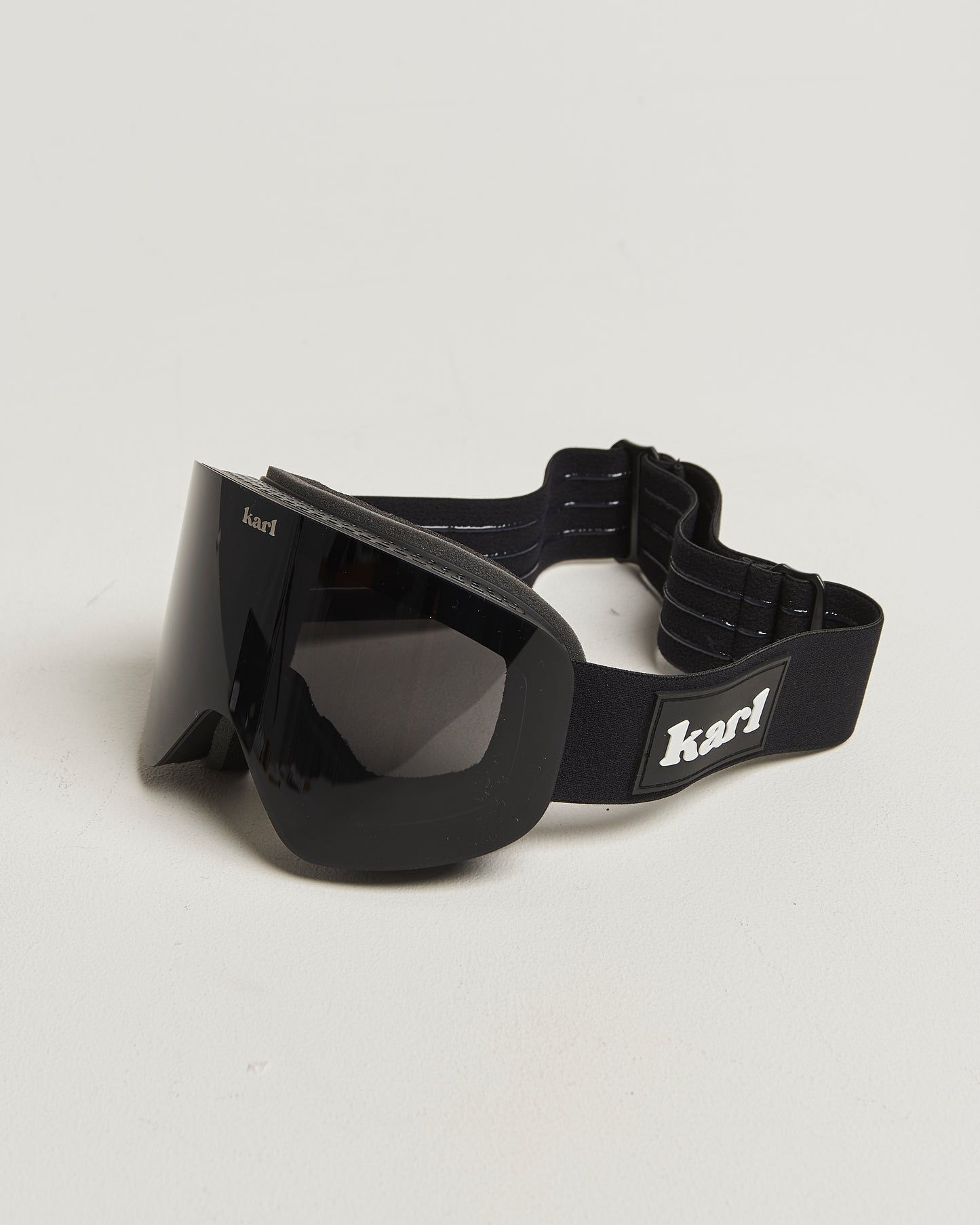 Black ski goggles with black lens side view