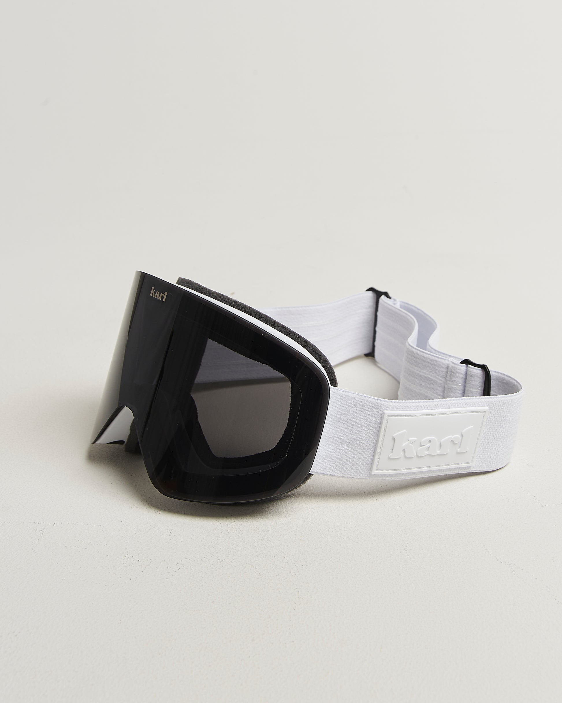 White ski goggles with black lens side view