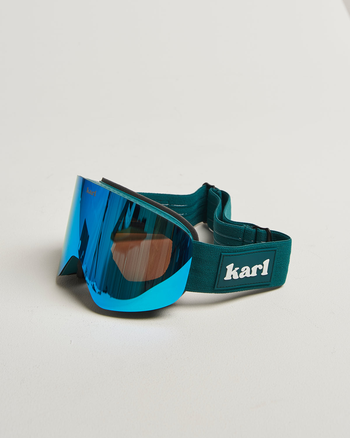 Green ski goggles with blue lens side view