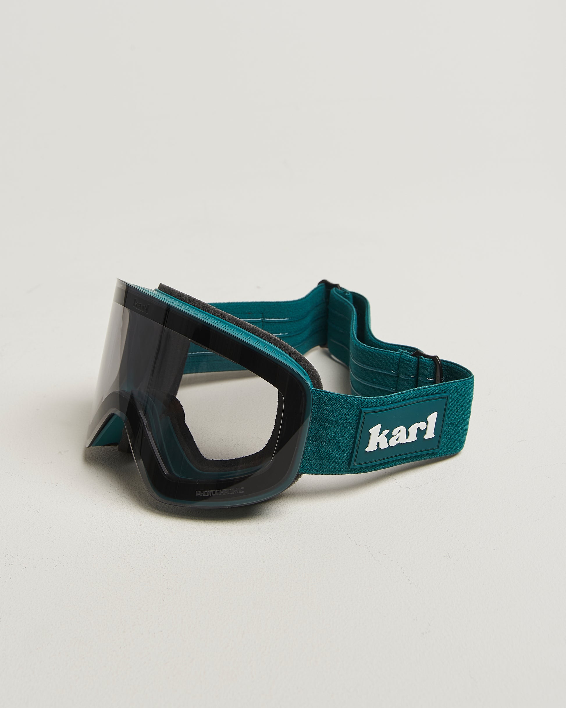 Green ski goggles with photochromic lens side view