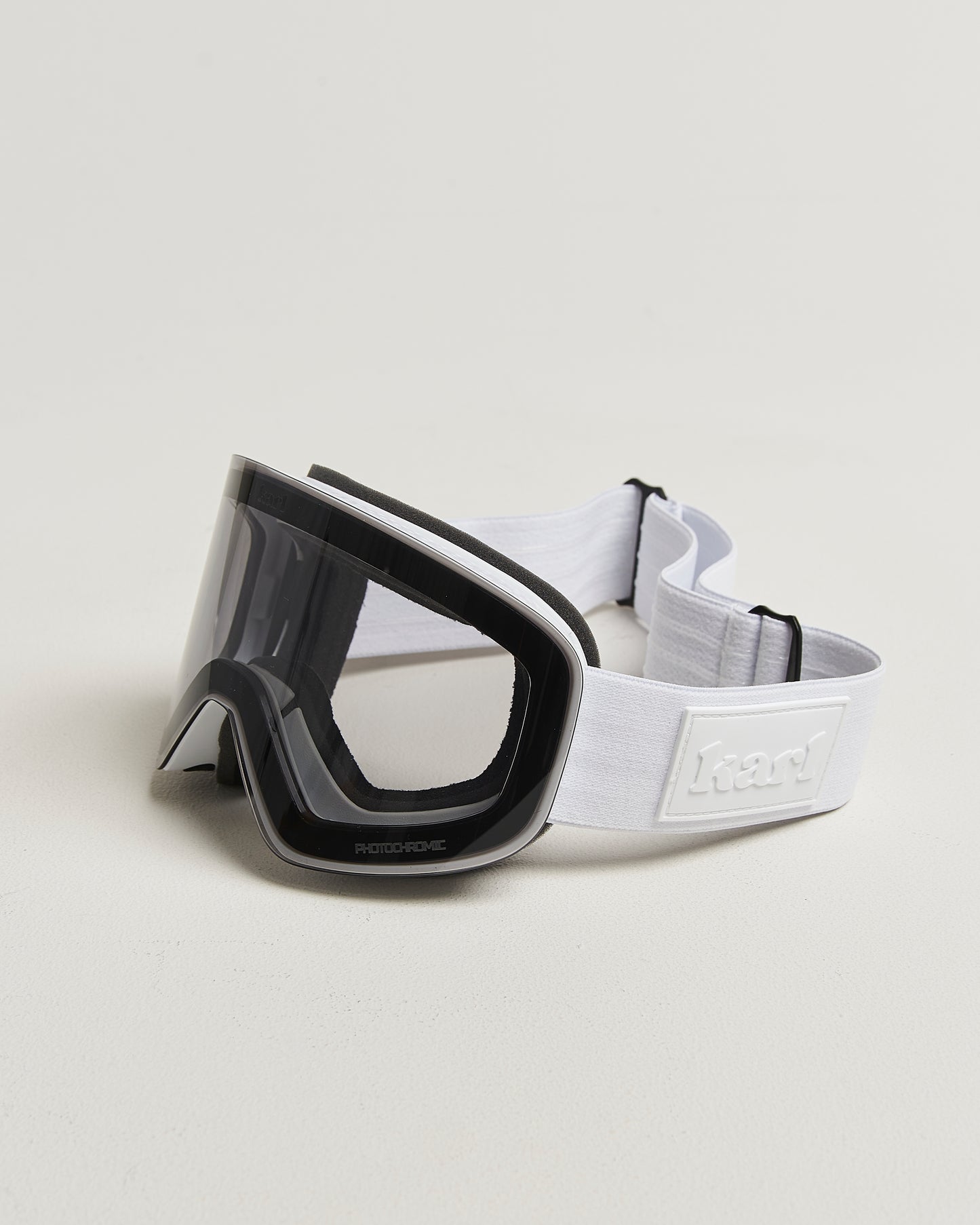 White ski goggles with photochromic lens side view