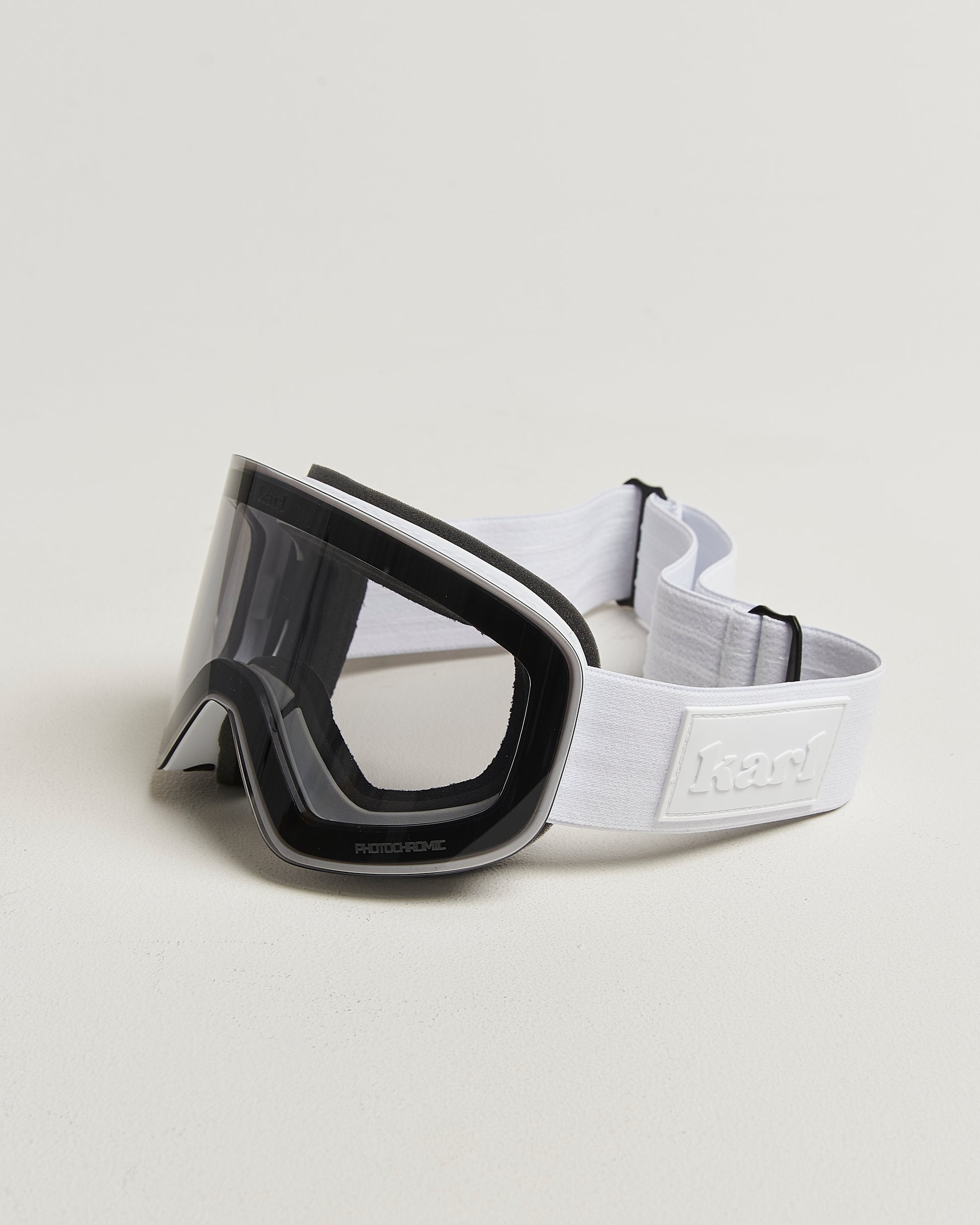 White ski goggles with photochromic lens side view